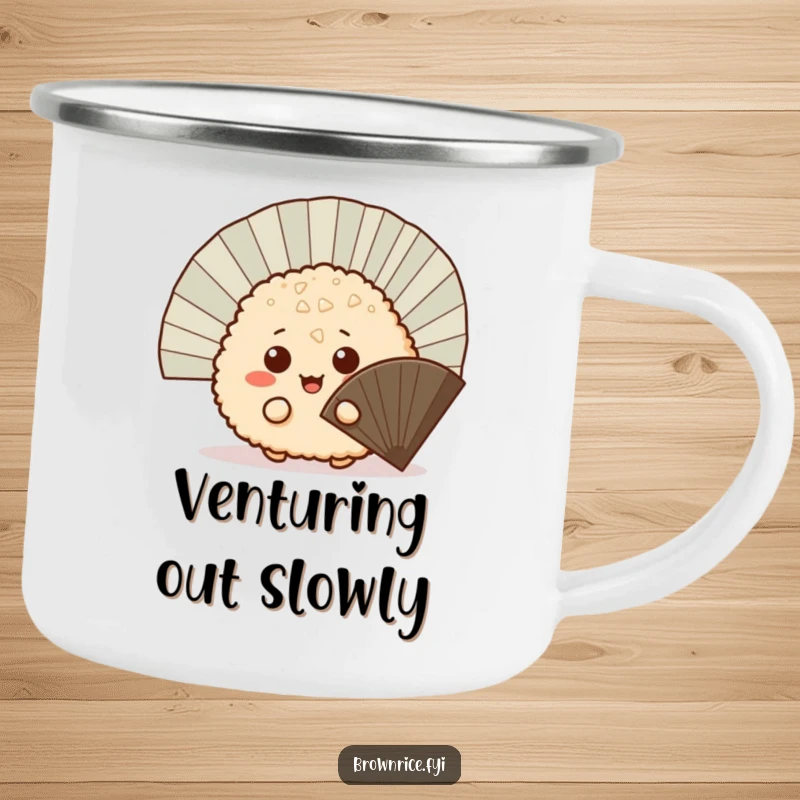 Funny mischievous brown rice ball peeking out from behind a fan, a durable enamel camping mug with a cute and playful cartoon.