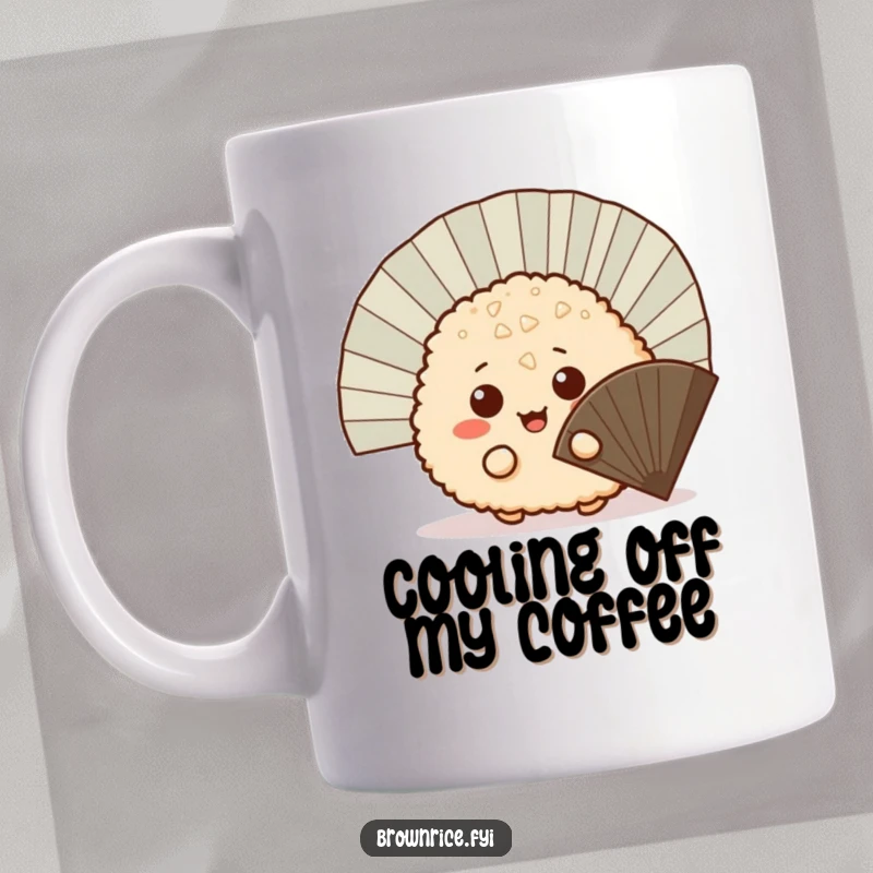 Funny mischievous brown rice ball peeking out from behind a fan, a playful cartoon illustration on a ceramic coffee mug.