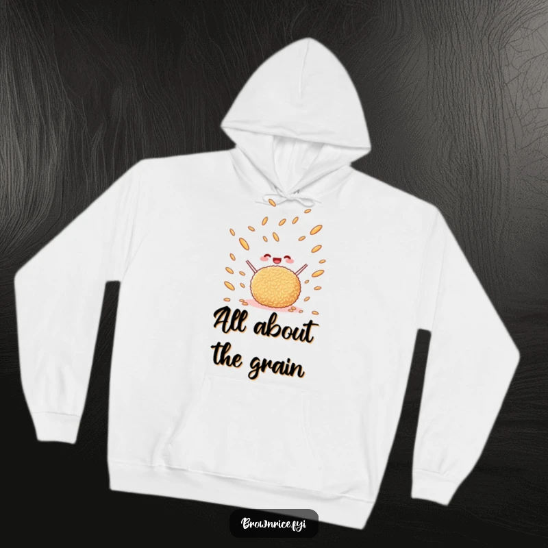 Funny happy brown rice ball tossing brown rice grains in the air, a cozy and warm hoodie with a whimsical cartoon design.