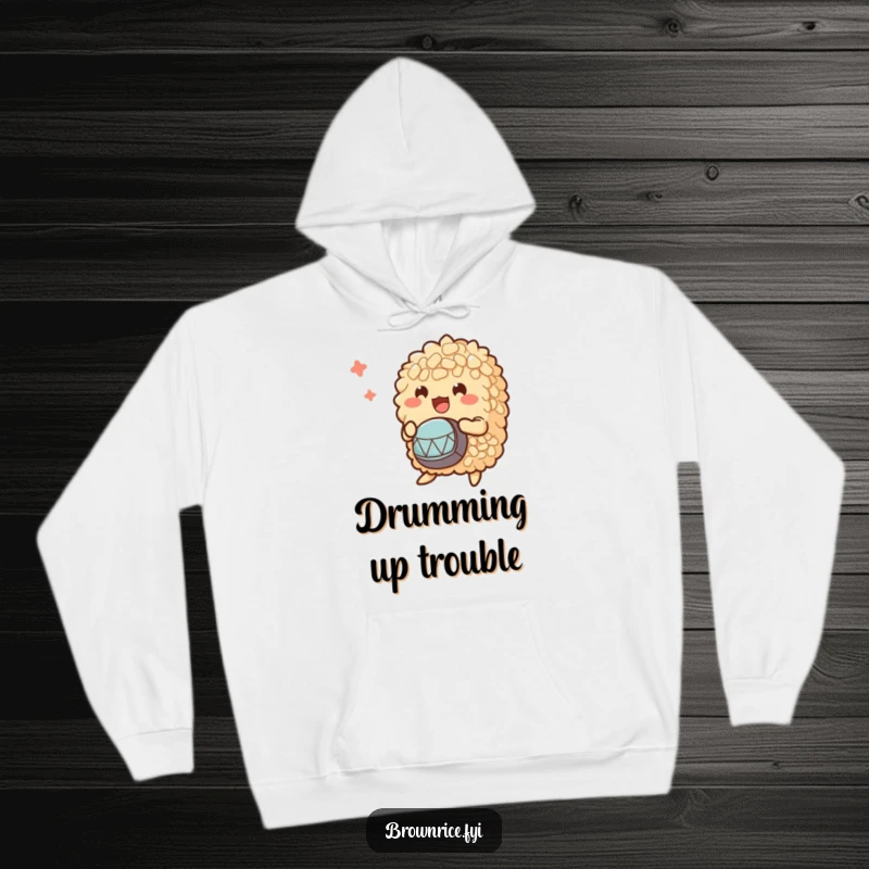 Funny hoodie displaying a group of brown rice characters enthusiastically playing small drums, perfect for cozy jam sessions.
