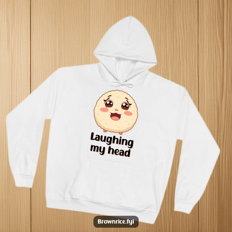 Funny surprised brown rice ball with wide eyes from laughter, a warm hoodie featuring a cute and humorous cartoon design.