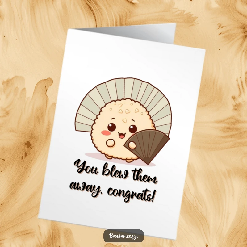 Funny Free Printable Congratulations Card: A mischievous brown rice ball peeking from behind a fan, revealing good news. Playful.