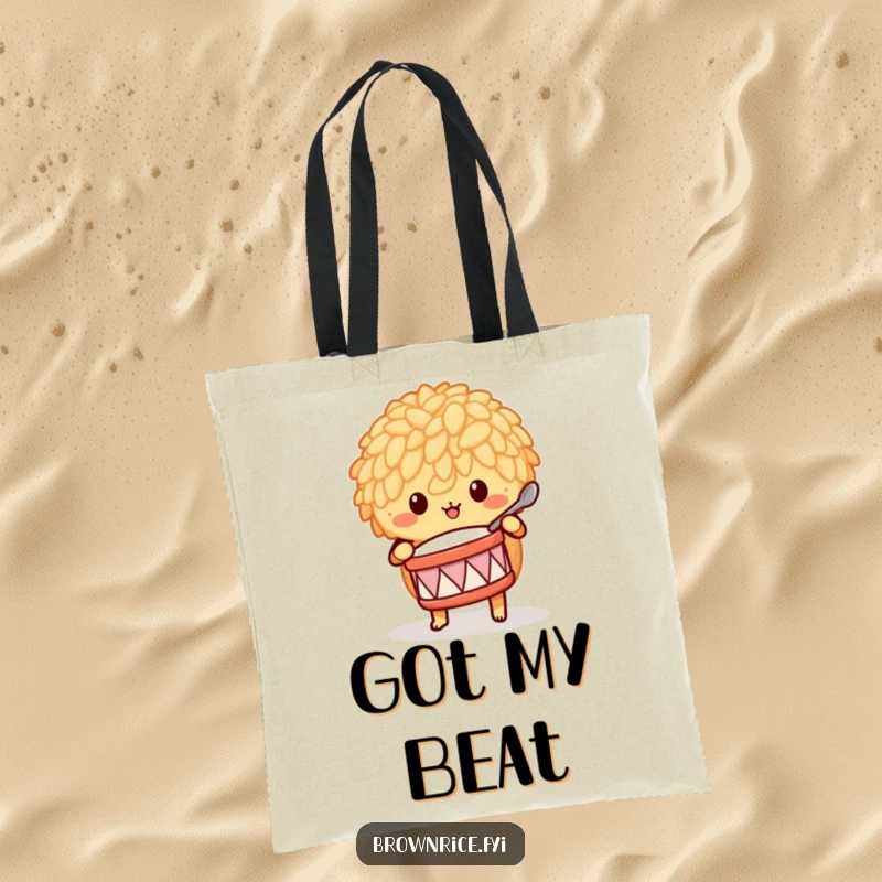 Funny brown rice character playing a tiny drum with a spoon, featured on a durable and humorous tote bag.